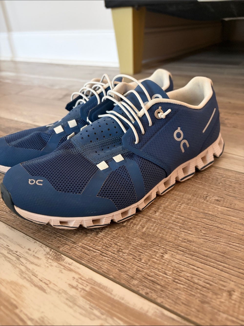 On Running Women’s  Athletic Cloud Sneakers in Navy and Cream